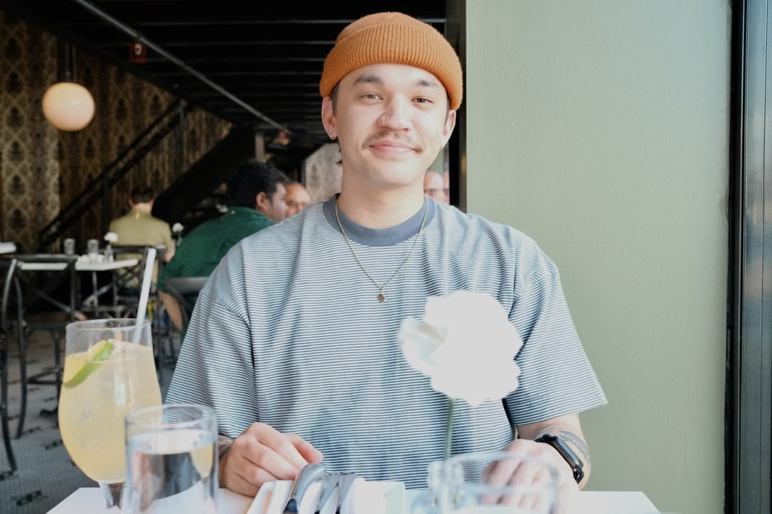 Brandon Daugherty wearing an orange beanie.